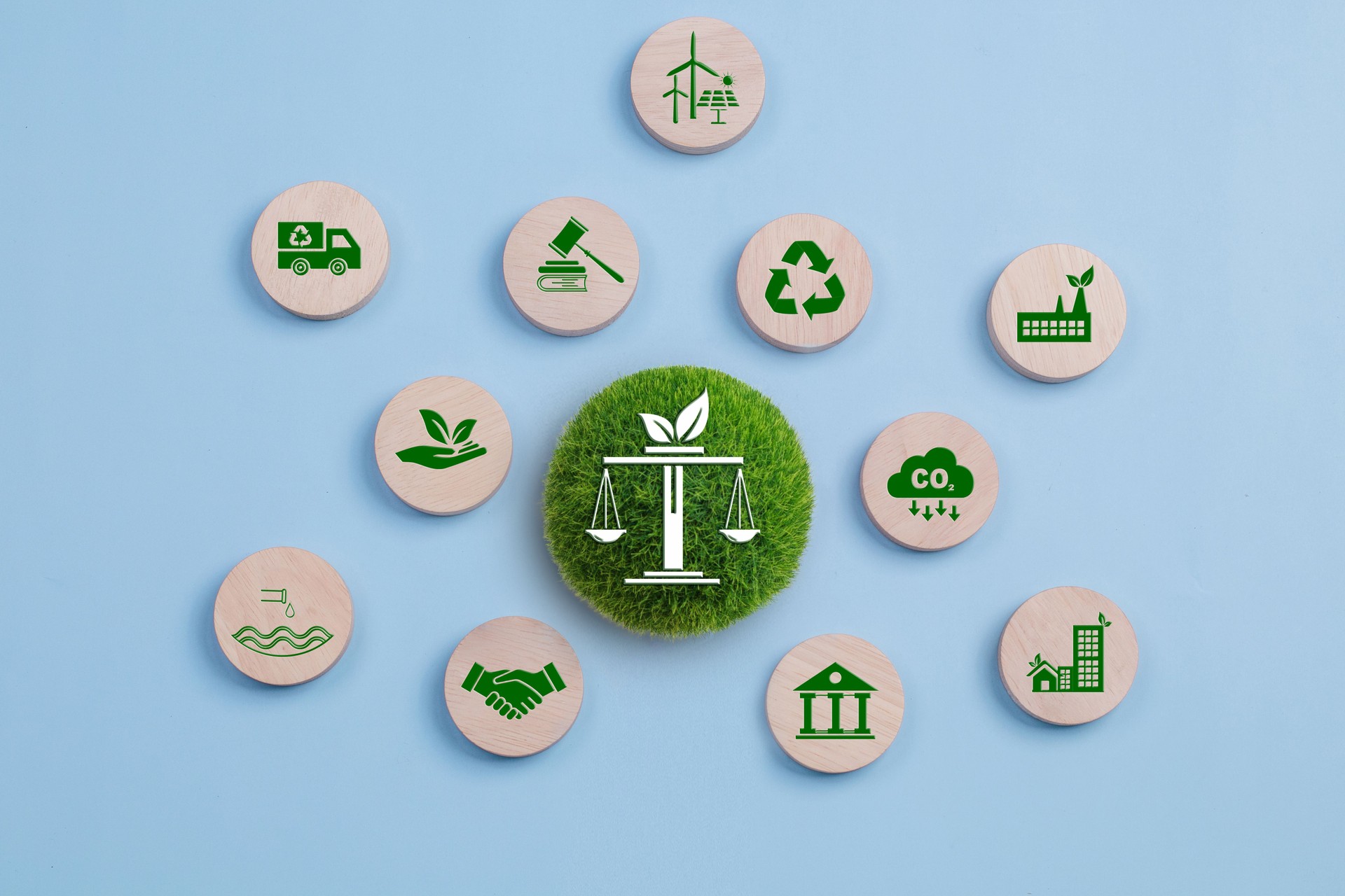 Environmental Law, International environmental policy. Wooden block on a blue background with green icons. sustainability. Eco friendly law, climate protection, sustainable energy policy.