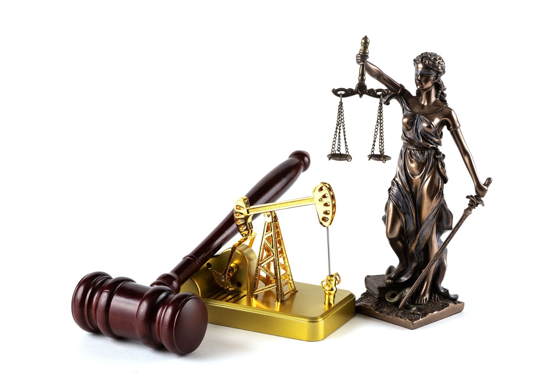 Miniature oil pump and Themis figure on white background